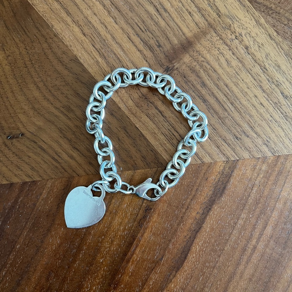 Tiffany & Co chain bracelet with heart charm.